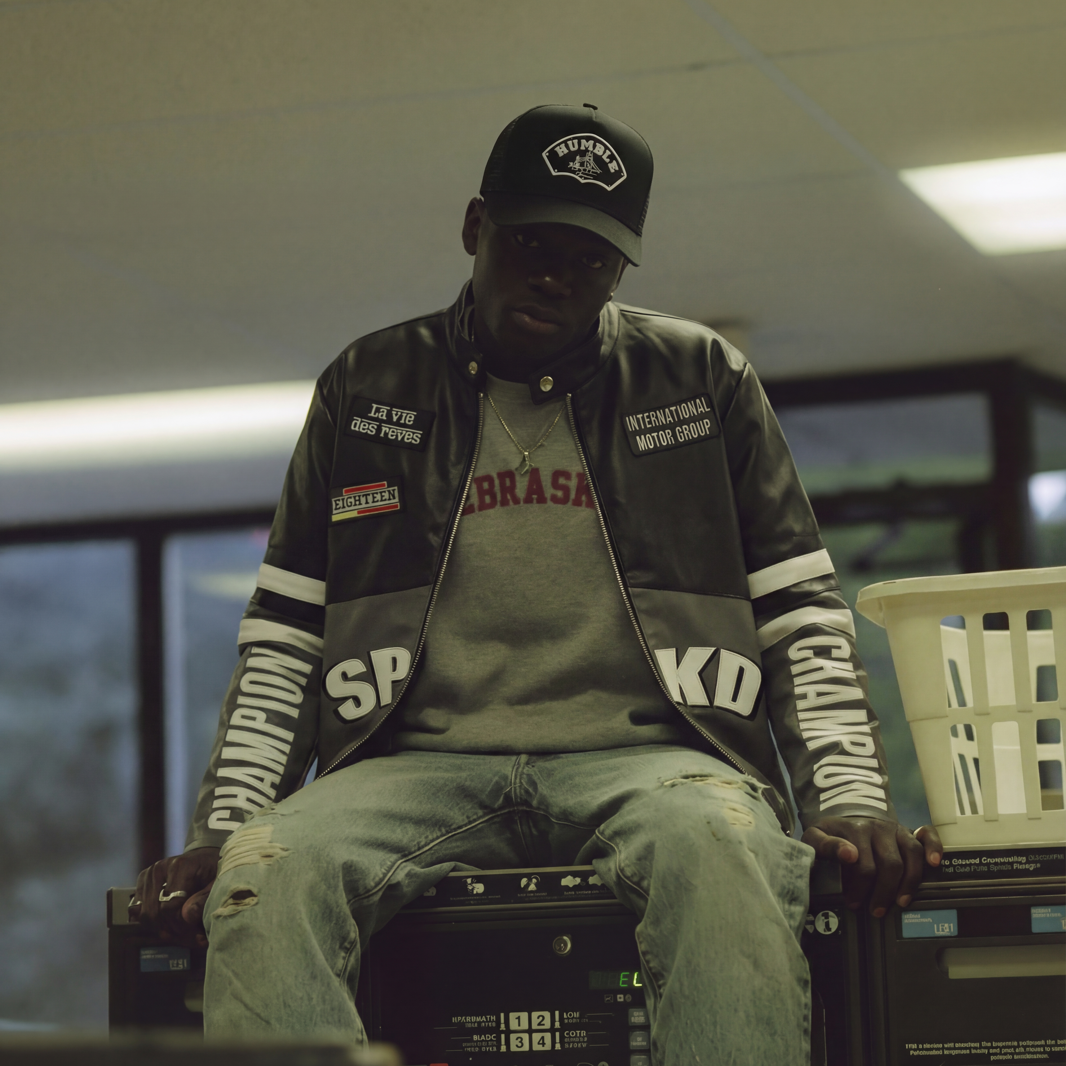 person wearing a black trucker cap