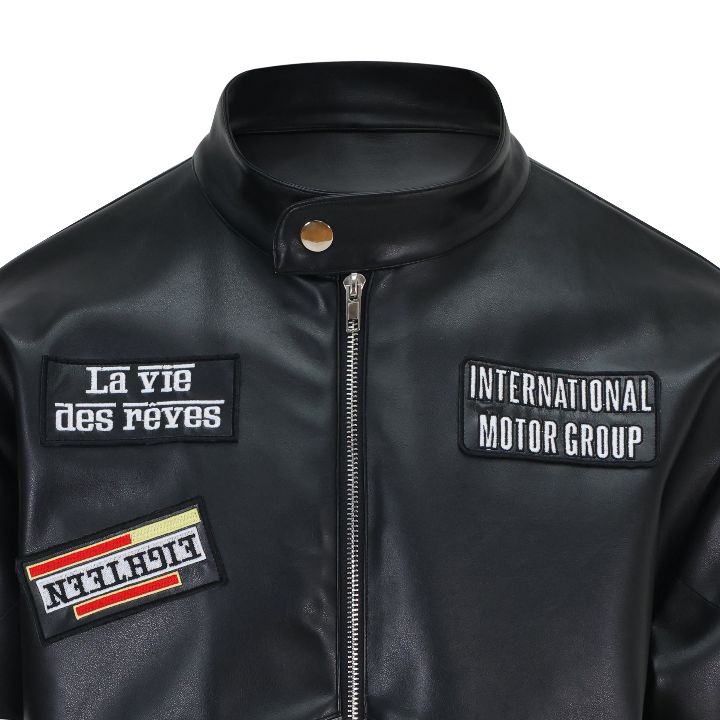 Black leather jacket with patches on a white background