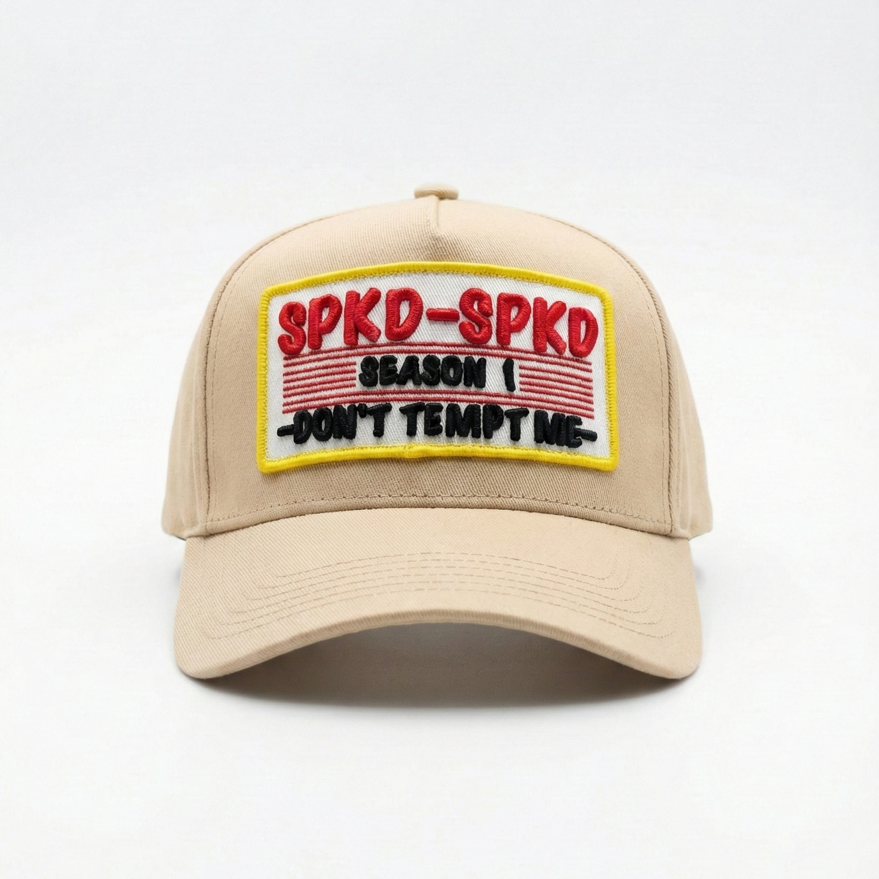 Beige cap with a colourful patch