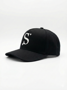 Black trucker cap with a white logo 