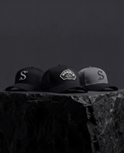 Three trucker caps with logos