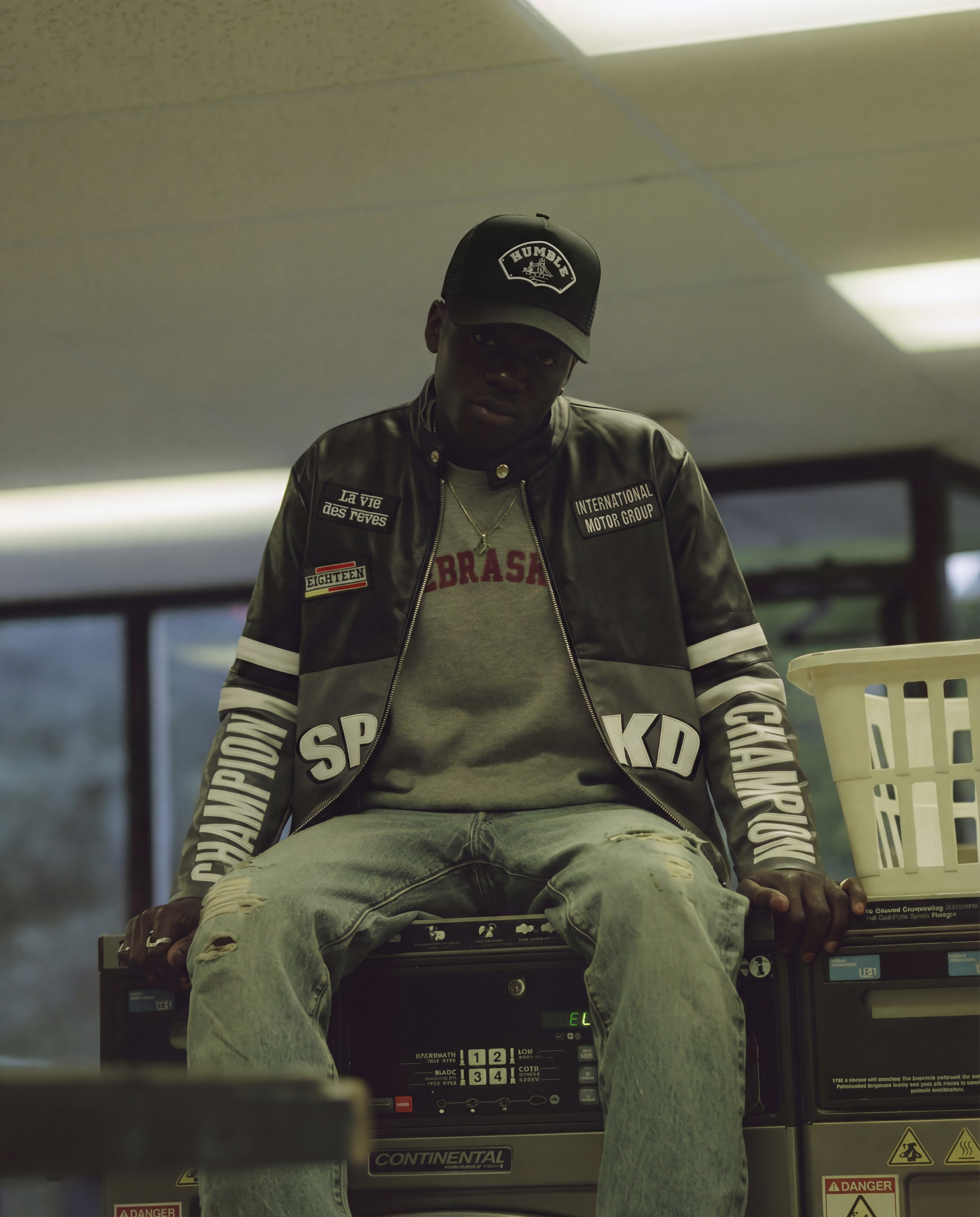 person wearing a black trucker cap