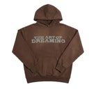 Brown hoodie with 'The Art of Dreaming' text on a white background